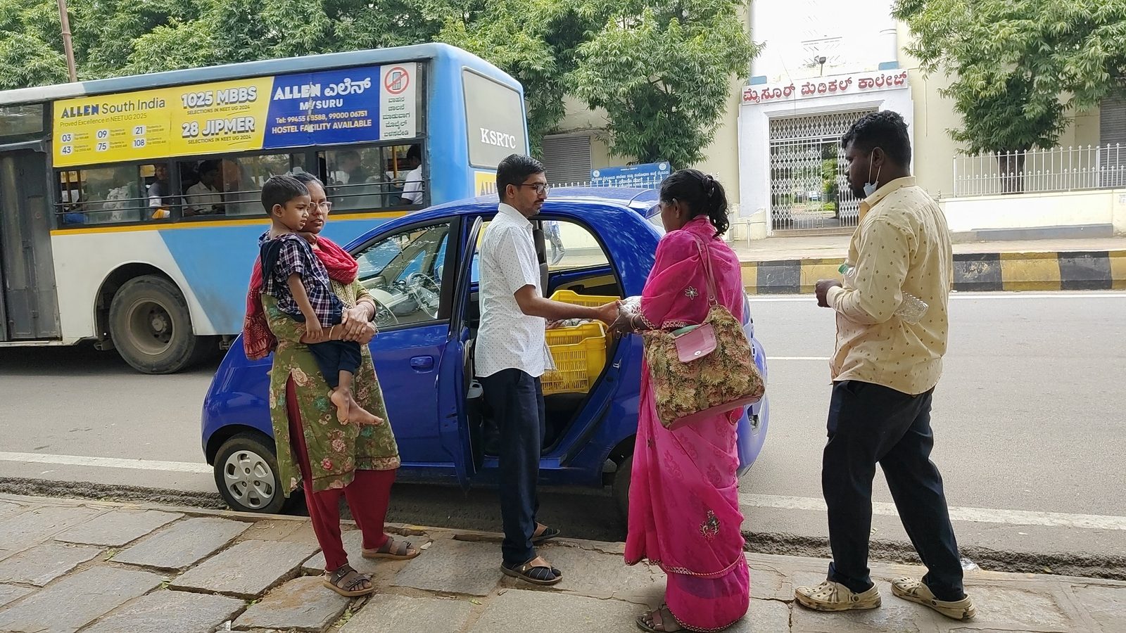 A food packet handed to a woman in Mysuru